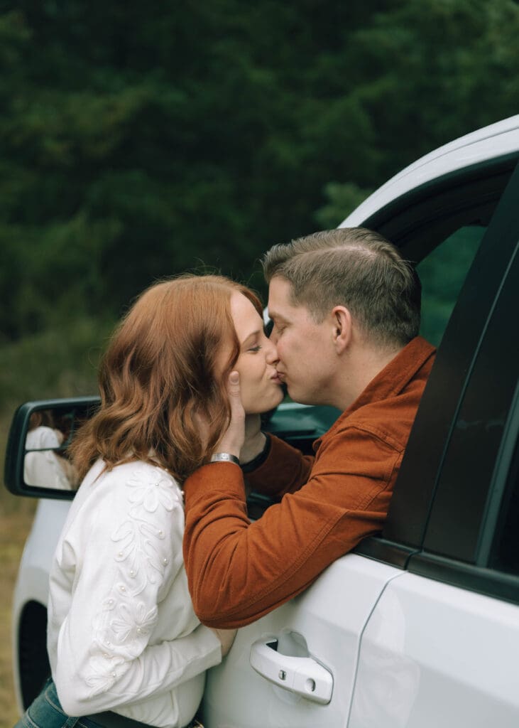 couple kissing in a truck