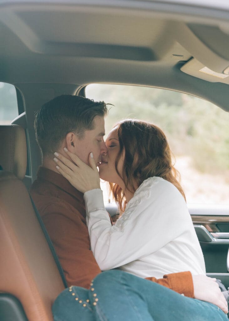 couple kissing in chevy silverado 