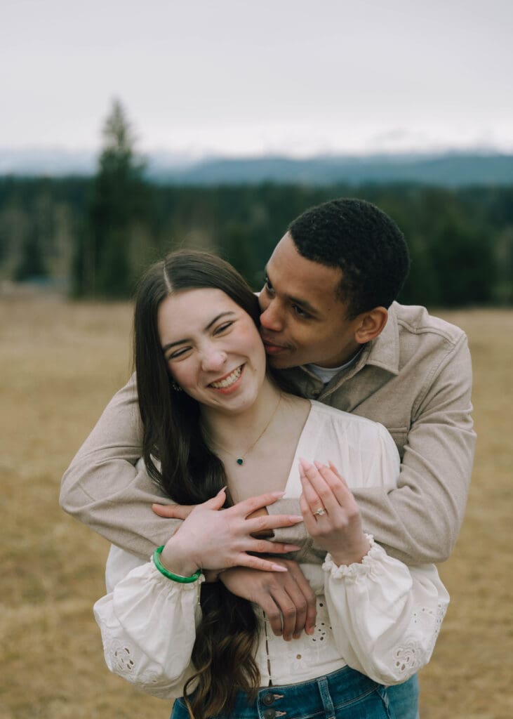 couple laughing and hugging