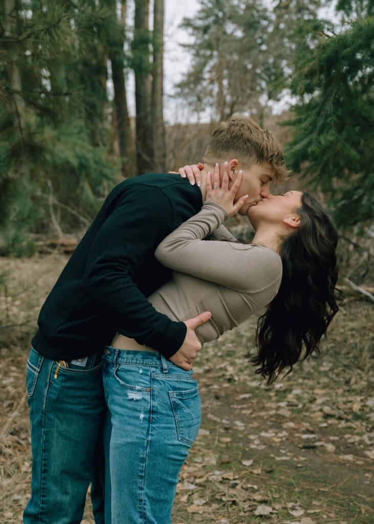 couple kissing and dipping in central washington park