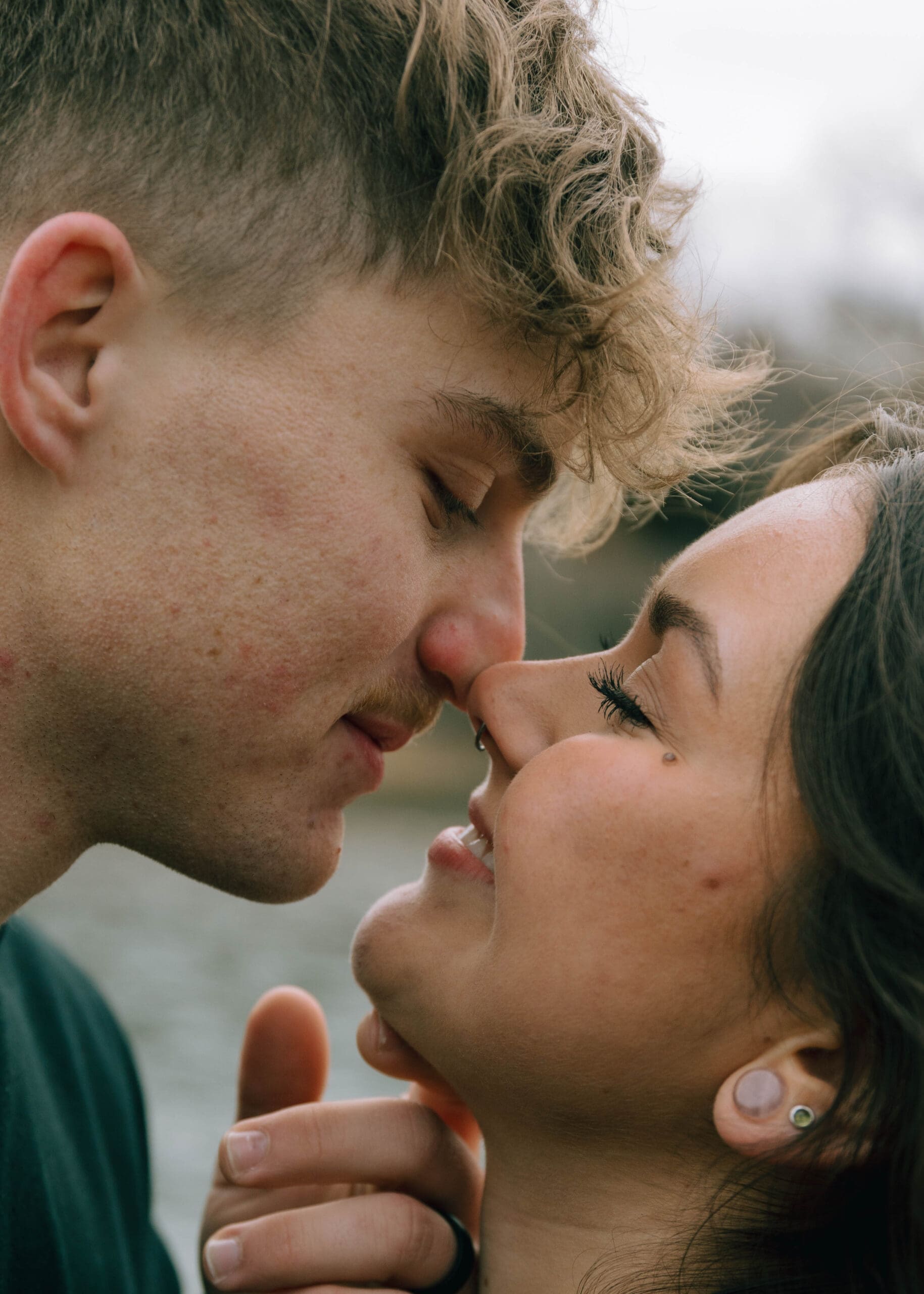 couple touching noses almost kissing. close up intimate shot