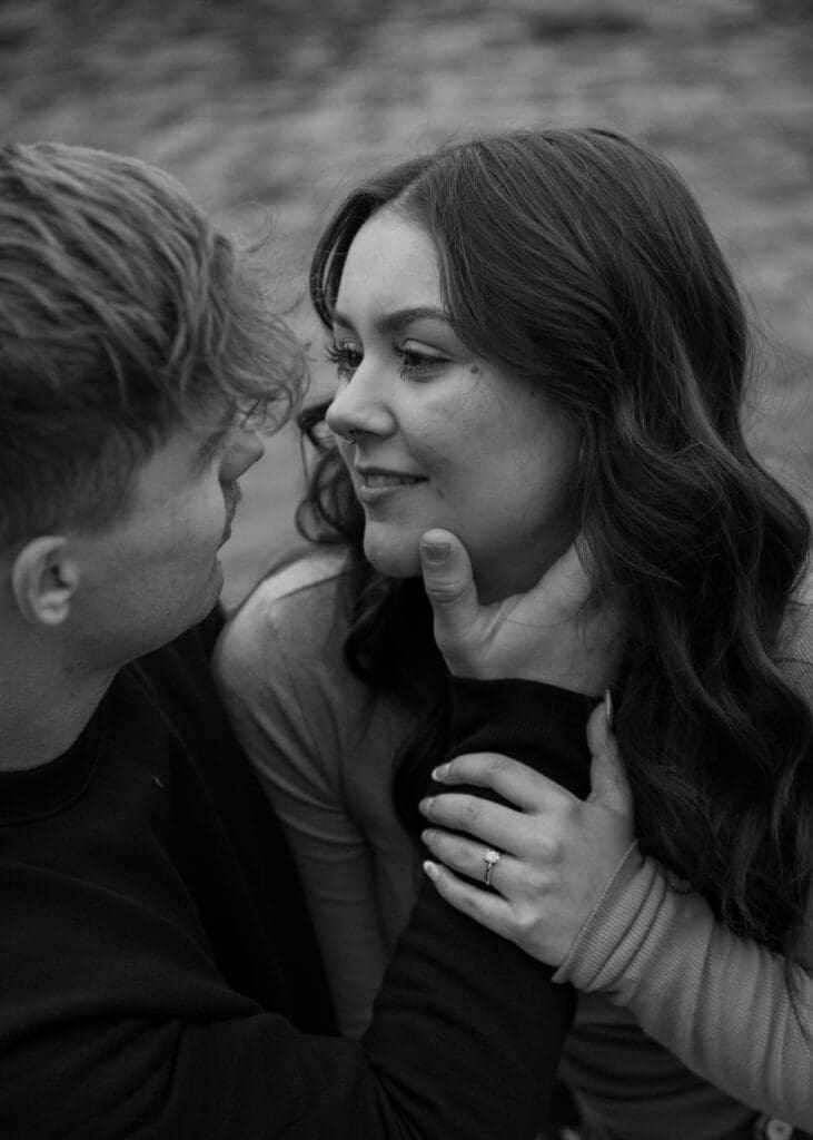 man holding womans face next to the yakima river 