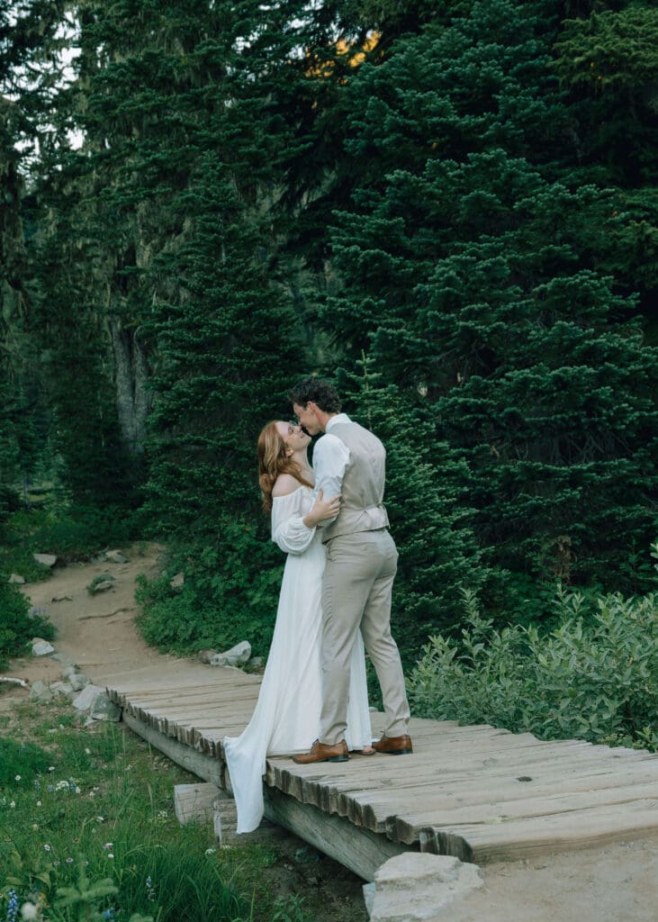 bride and groom almost kissing at Mt. Rainier at Tipsoo Lake 