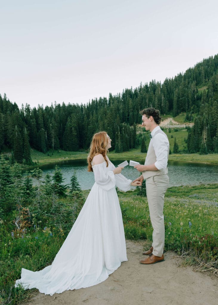 bride and groom exchanging vows at lake tipsoo at Mt rainier 