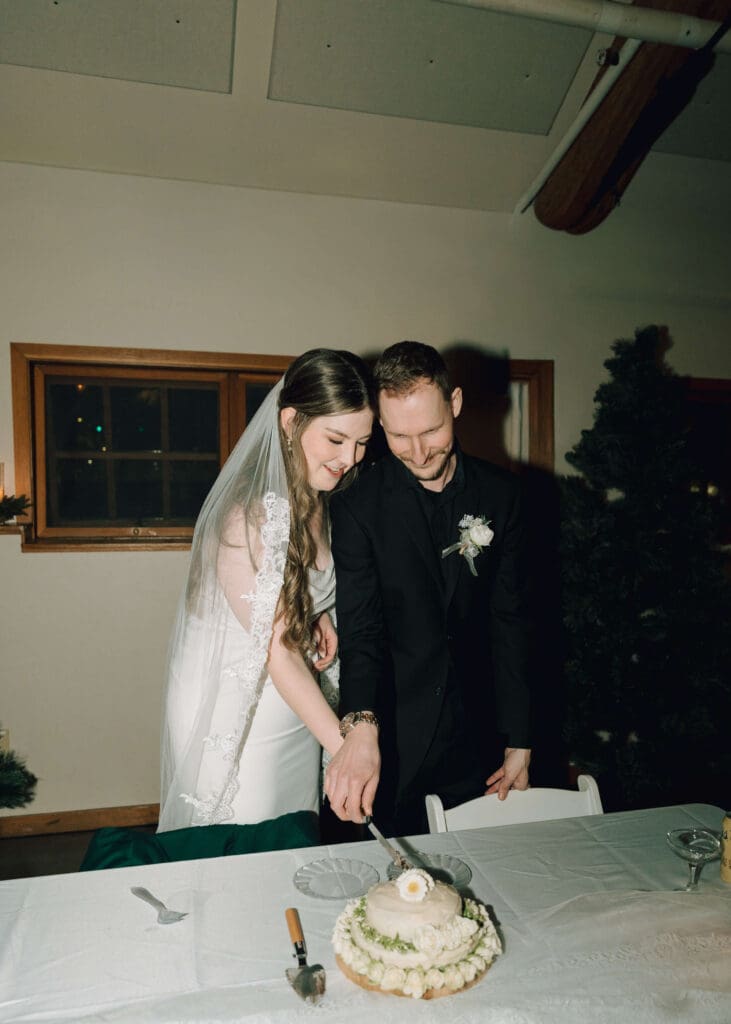 bride and groom cutting their cake at their wedding reception in Issaquah 