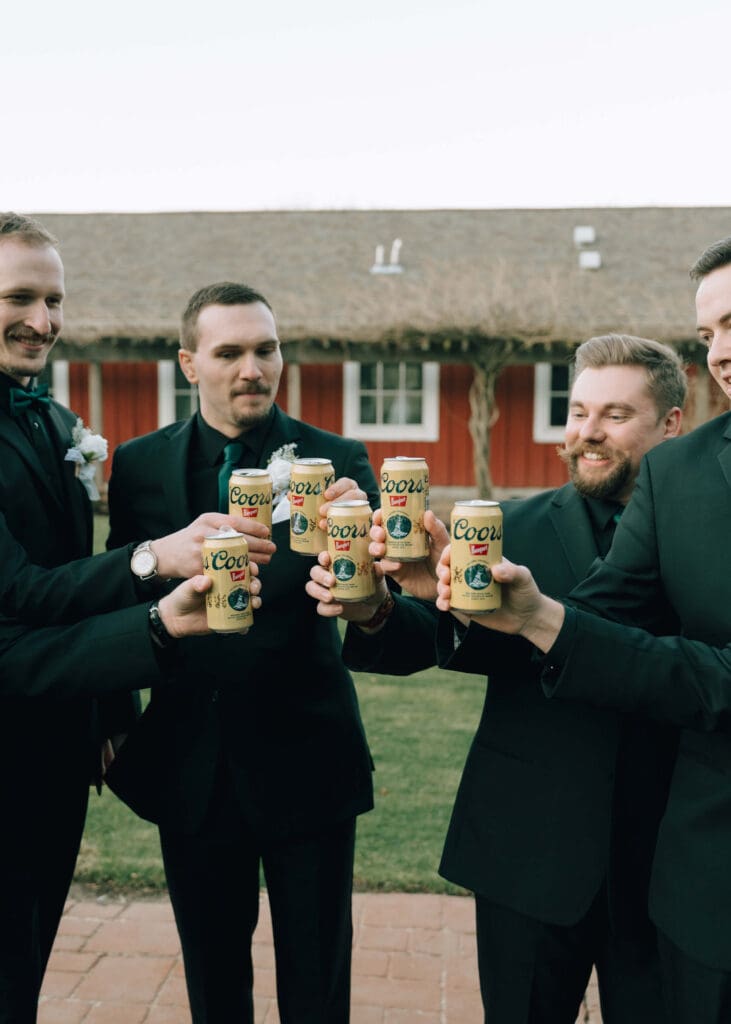 groomsmen toasting coors banquet beer at Pickering Barn wedding 