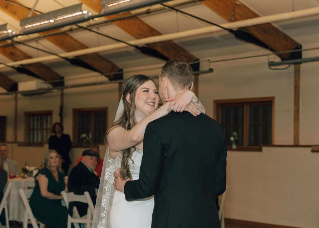 bride and groom smiling and dancing at wedding reception in Issaquah 