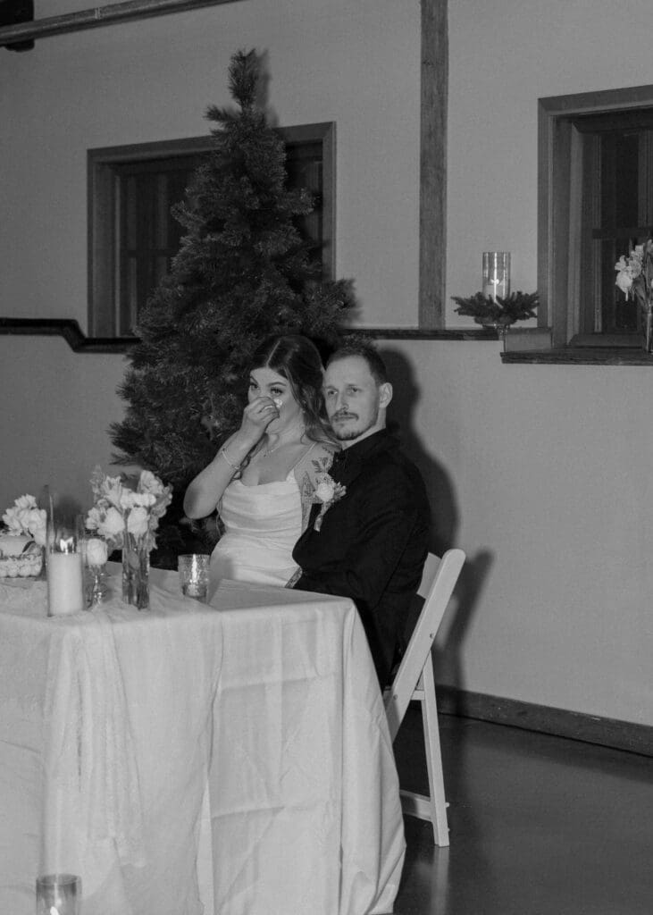 bride wiping tears away during speeches at Pickering Barn 