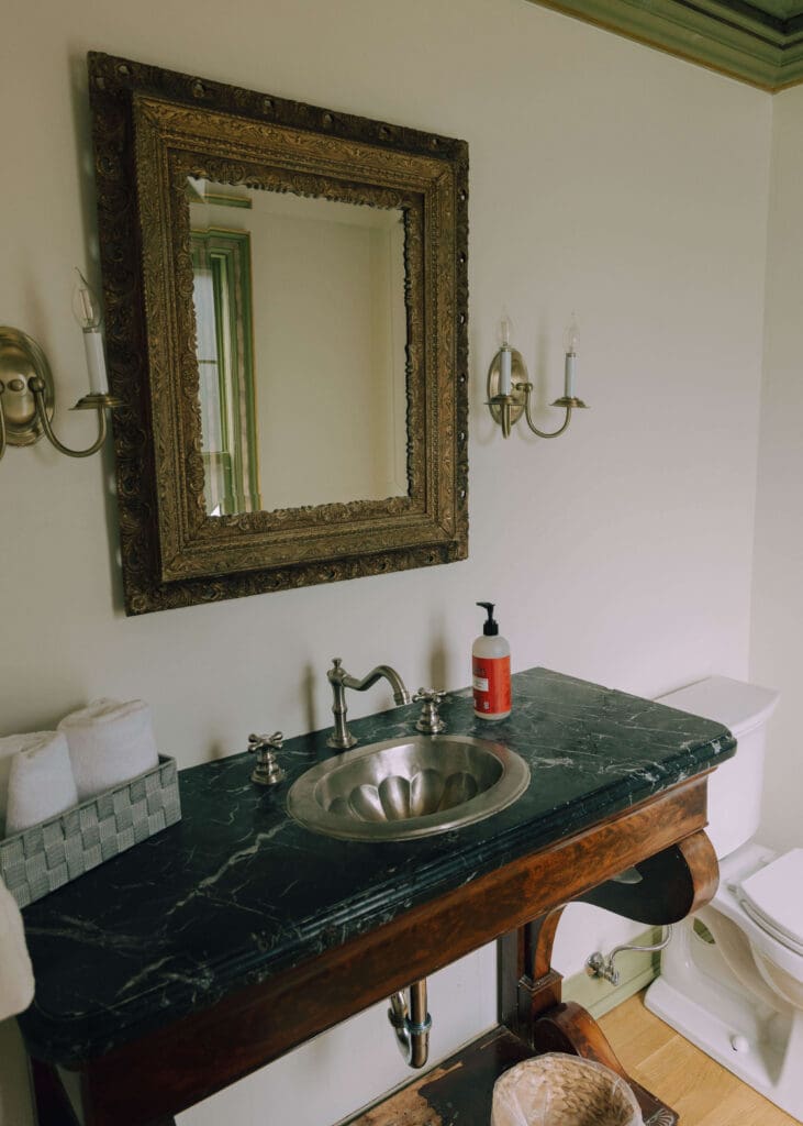 vintage looking bathroom with black countertops at washington wedding venue 