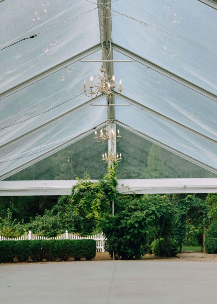 glass pavilion outside with chandelier at washington wedding venue 