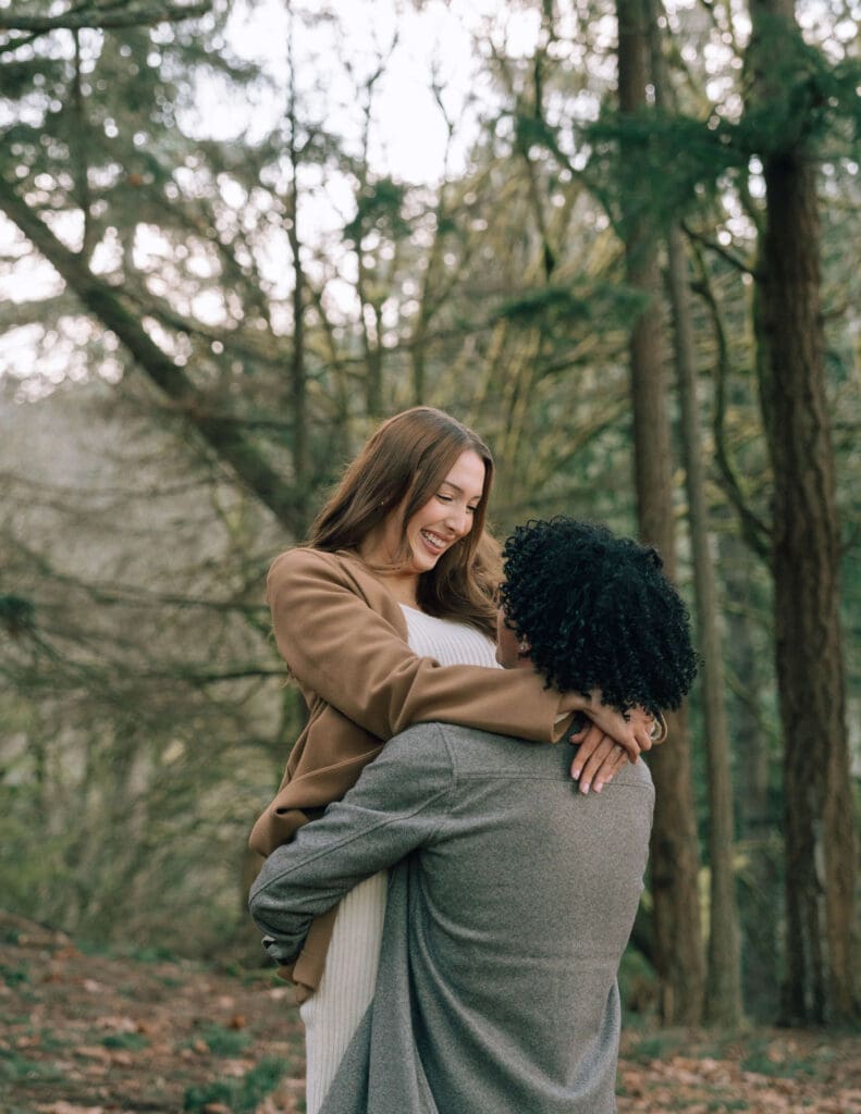 man with curly black hair picking up fiance in Tacoma
