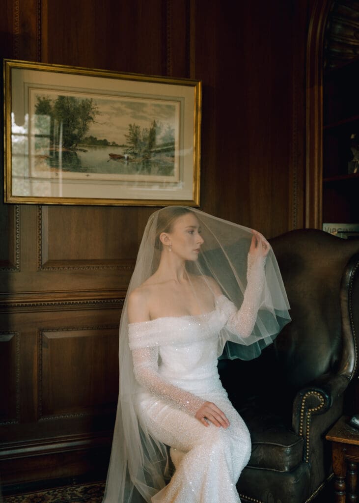 reasons to get bridal portraits done- bride under veil in study 