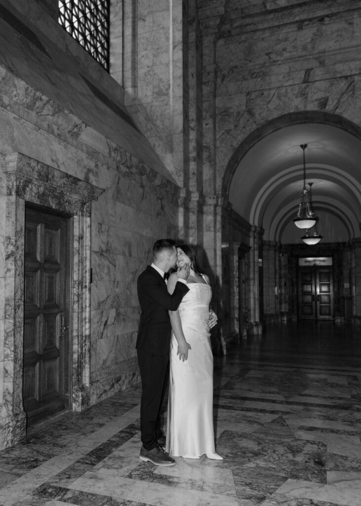 couple almost kissing inside washington state capitol for engagement photos