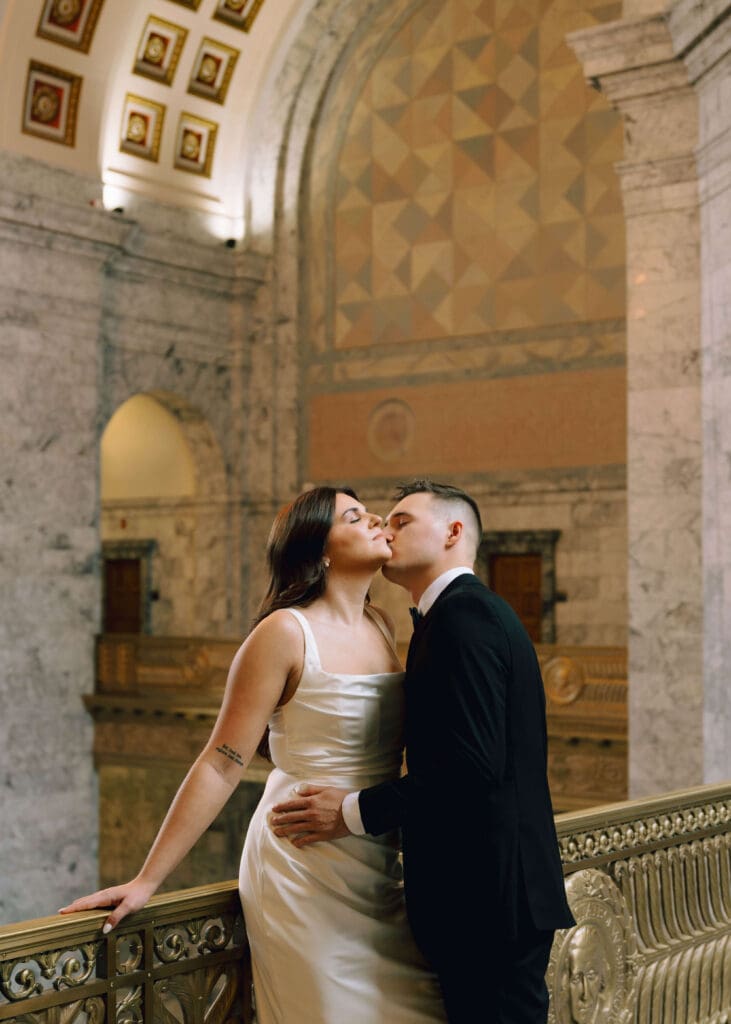groom kissing his bride on the cheek in Olympia at wedding 