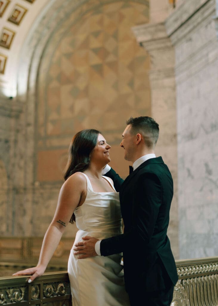 groom sweeping hair behind bride's ear at Washington state capitol wedding
