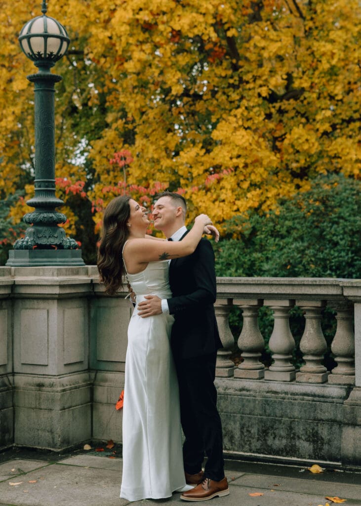 couple laughing in Fall in Olympia at wedding at washington state capitol 