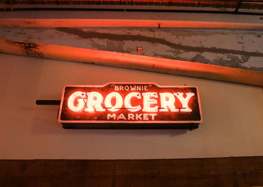 red glowing grocery sign at Tacoma wedding venue