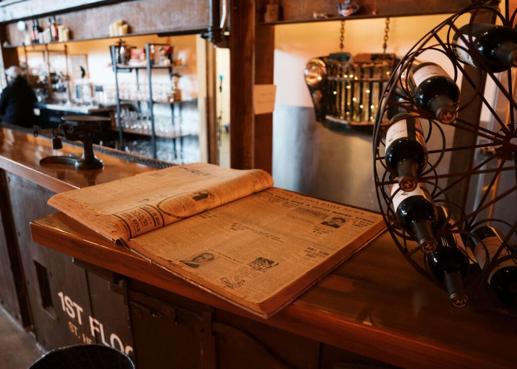 open book of vintage newspapers at Tacoma wedding venue
