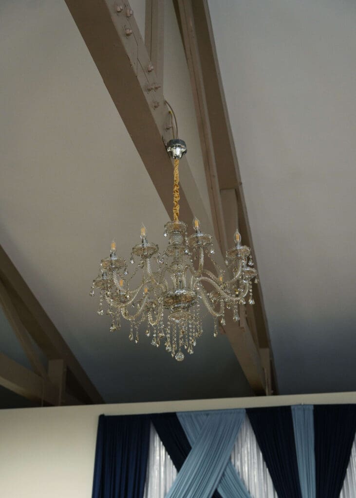 crystal chandelier hanging from the ceiling at Vickery Gardens