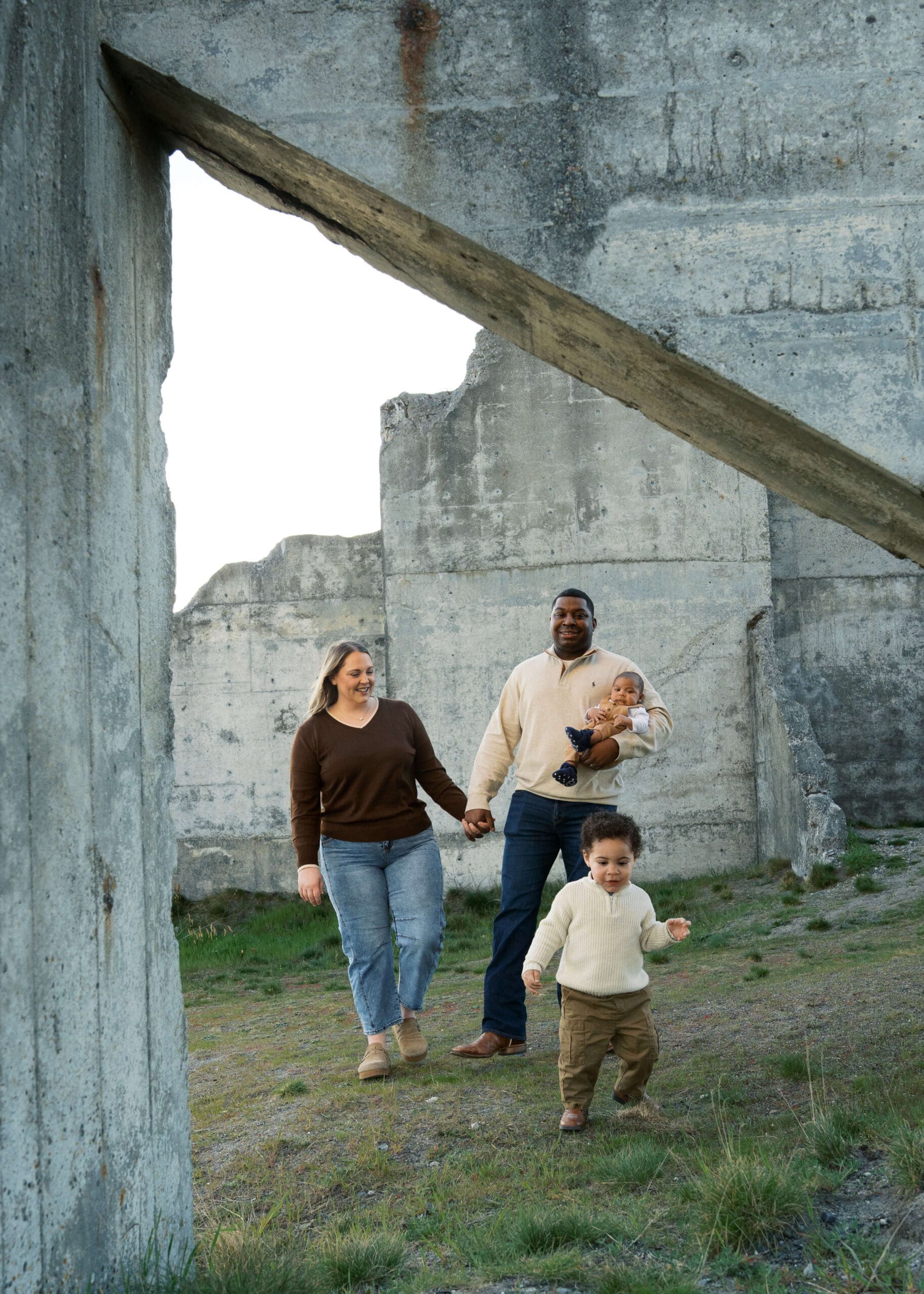 family holding hands and walking at chambers bay