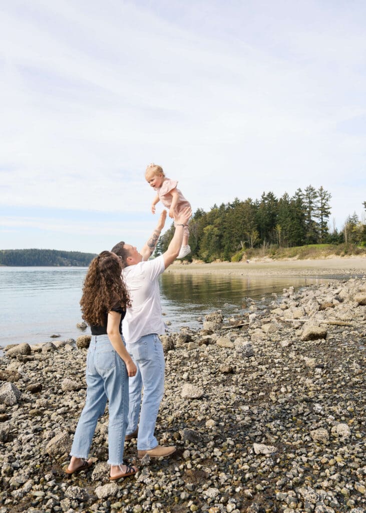 point defiance family photos of dad tossing toddler girl in the air 