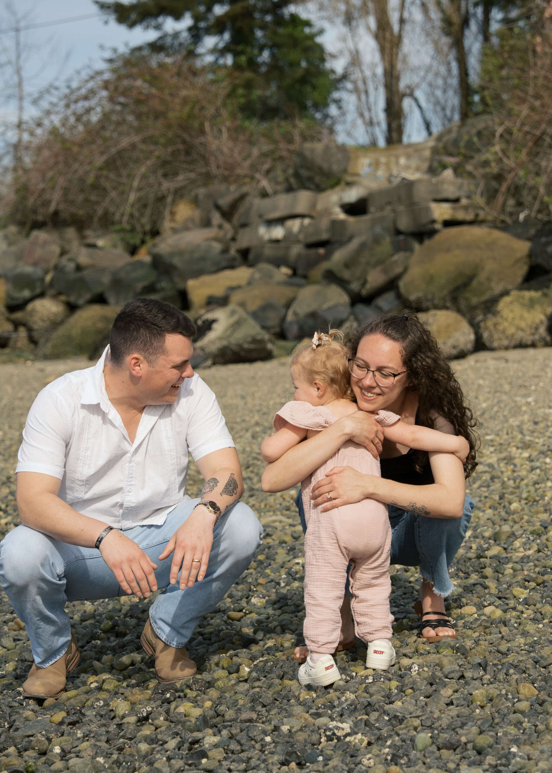 mom hugging toddler girl on Titlow beach