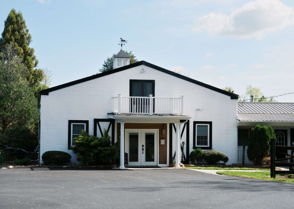outside of stable with barn doors at Virginia wedding venue