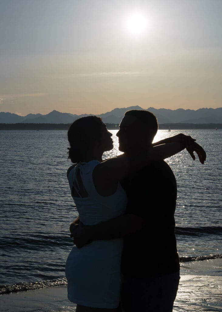 silhouette of a couple at the beach for engagement photos in Seattle