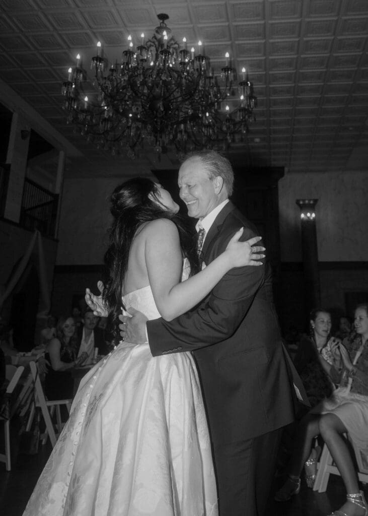 bride and dad laughing while dancing at Silver Cloud Hotel wedding
