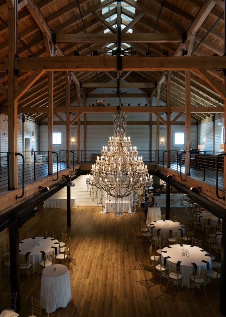 chandelier hanging from rafters of northern virginia wedding hall