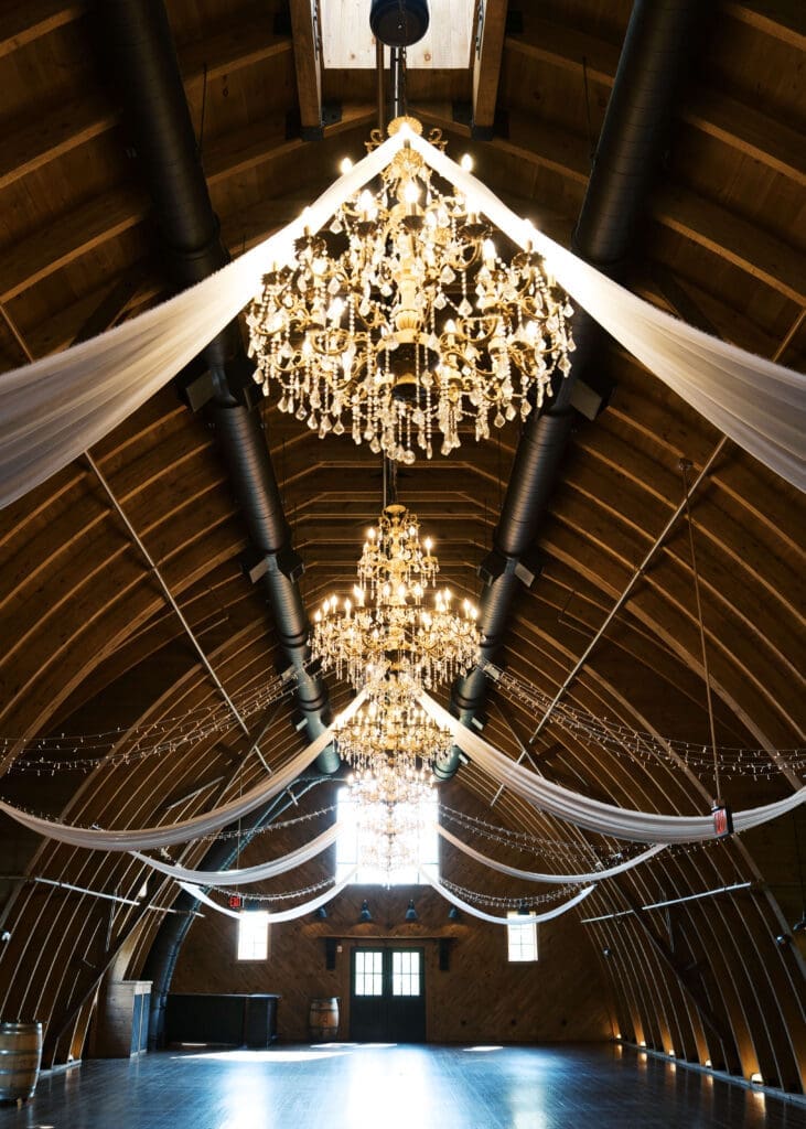 lit chandeliers at barn wedding venue in northern virginia