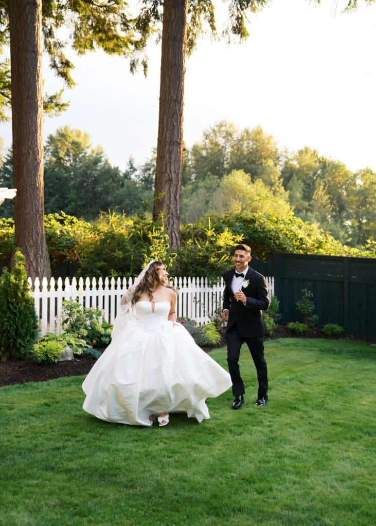groom chasing the bride at golden hour at Vickery Gardens in the summer