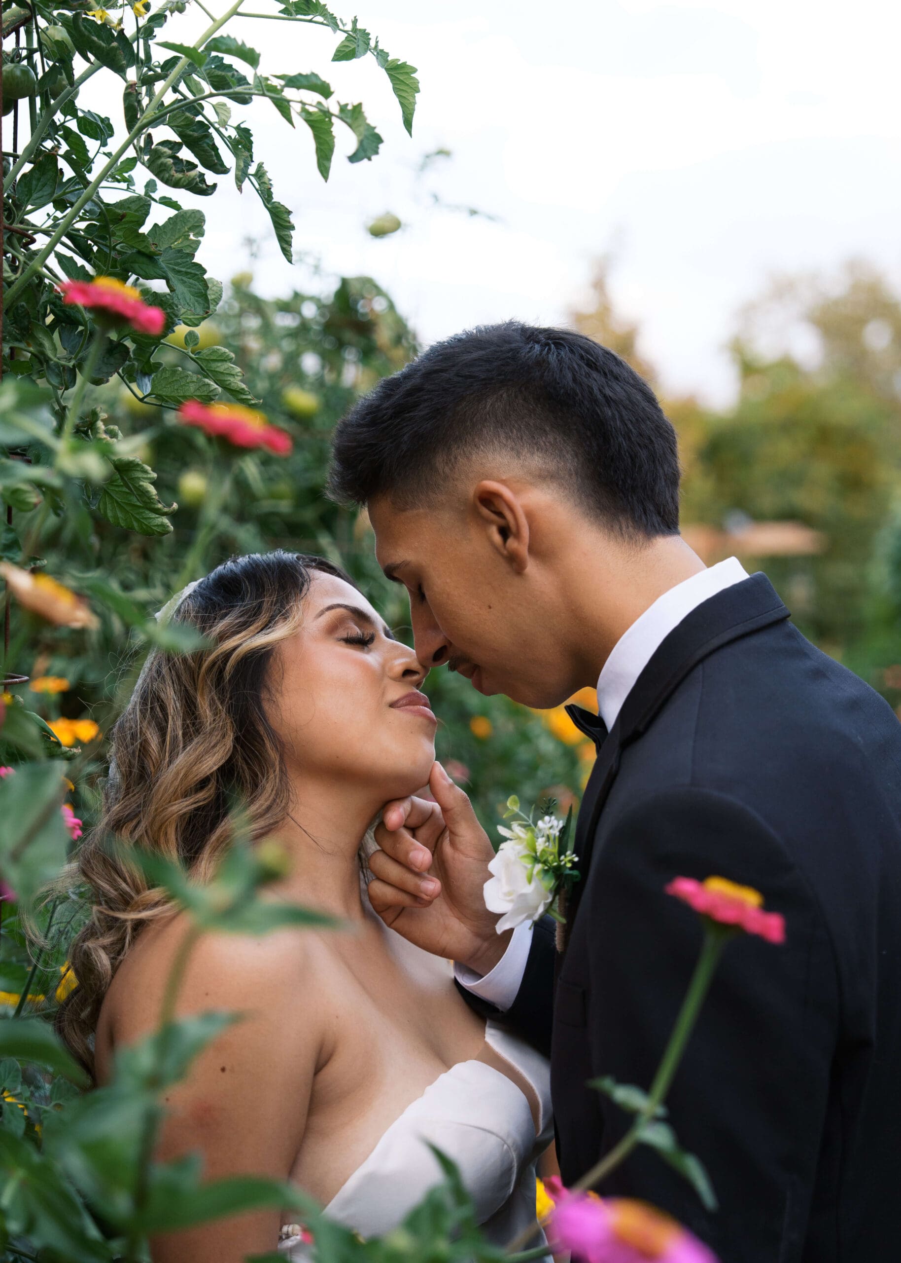 bride and groom in the garden nose to nose at Vickery Gardens