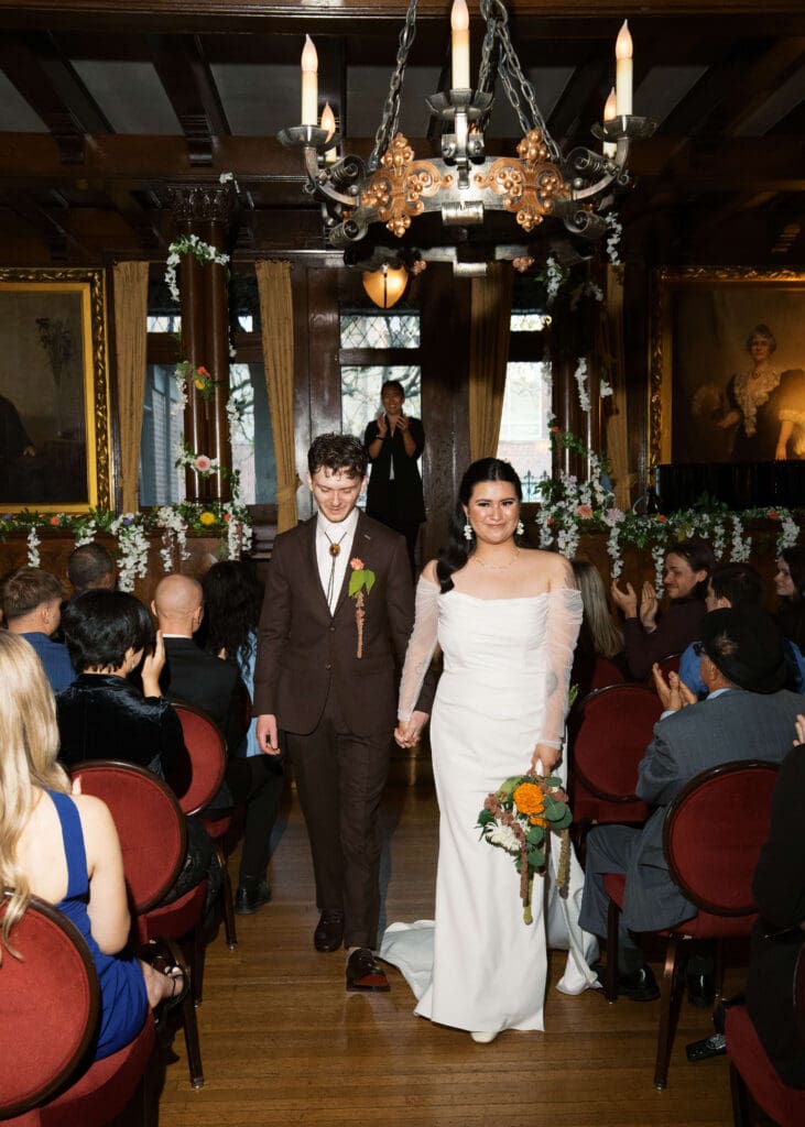 bride and groom walking down the aisle after the wedding ceremony indoors at Stimson-Green Mansion