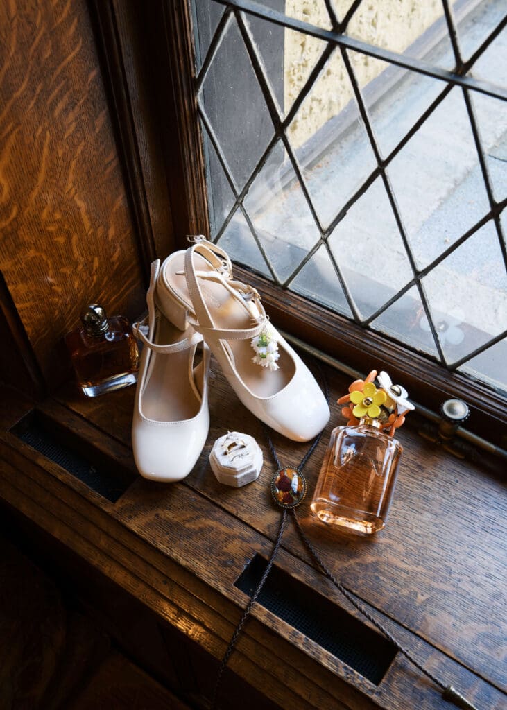 shoes, perfume, jewelry, rings, tie and cologne on a window sill at Stimson-Green Mansion